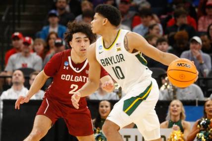 Mar 22, 2024; Memphis, TN, USA;  Baylor Bears guard RayJ Dennis (10) dribbles against Colgate Raiders guard Braeden Smith (2) during the second half of the NCAA Tournament First Round at FedExForum. Mandatory Credit: Petre Thomas-USA TODAY Sports