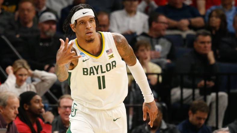 Mar 22, 2024; Memphis, TN, USA; Baylor Bears forward Jalen Bridges (11) reacts after a three-point shot against the Colgate Raiders during the second half of the NCAA Tournament First Round at FedExForum. Mandatory Credit: Petre Thomas-USA TODAY Sports