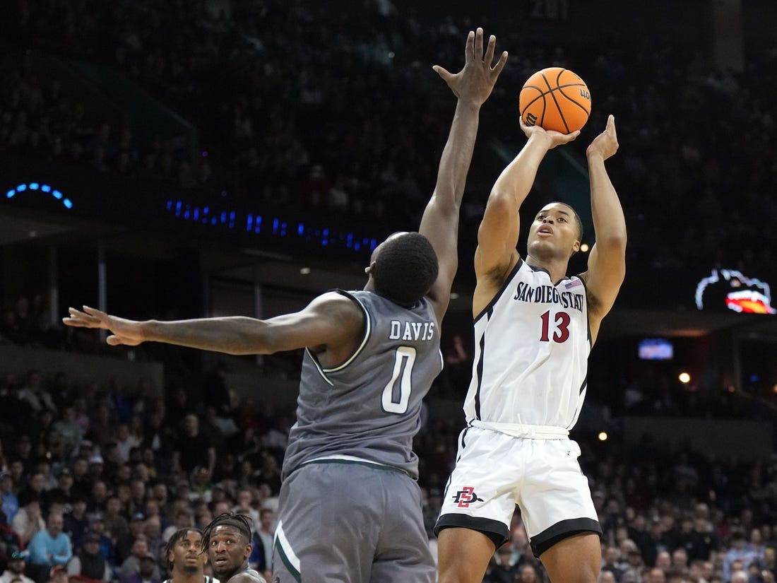Mar 22, 2024; Spokane, WA, USA; San Diego State Aztecs forward Jaedon LeDee (13) attempts a basket against UAB Blazers forward Javian Davis (0) during the second half in the first round of the 2024 NCAA Tournament at Spokane Veterans Memorial Arena. Mandatory Credit: Kirby Lee-USA TODAY Sports