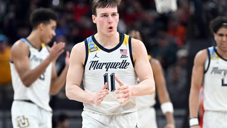 Mar 22, 2024; Indianapolis, IN, USA; Marquette Golden Eagles guard Tyler Kolek (11) reacts in the second half against the Western Kentucky Hilltoppers in the first round of the 2024 NCAA Tournament at Gainbridge FieldHouse. Mandatory Credit: Robert Goddin-USA TODAY Sports