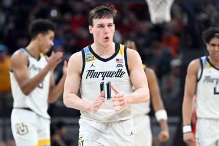 Mar 22, 2024; Indianapolis, IN, USA; Marquette Golden Eagles guard Tyler Kolek (11) reacts in the second half against the Western Kentucky Hilltoppers in the first round of the 2024 NCAA Tournament at Gainbridge FieldHouse. Mandatory Credit: Robert Goddin-USA TODAY Sports