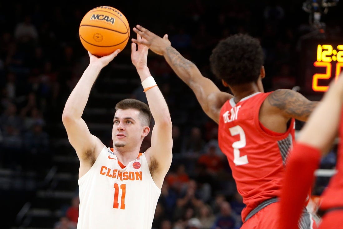 Clemson's Joseph Girard III (11) shoots the ball as New Mexico's Donovan Dent (2) tries to block him during the first round game between Clemson University and University of New Mexico in the 2024 NCAA Tournament at FedExForum in Memphis, Tenn., on Friday, March 22, 2024.