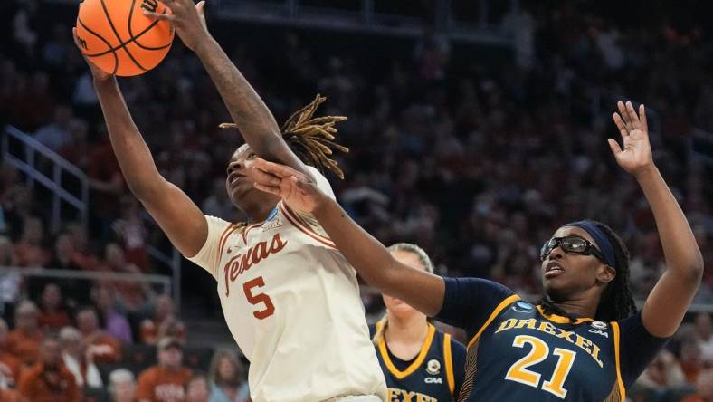 First round: Texas Longhorns forward DeYona Gaston (5) snares a rebound in front of Drexel Dragons forward Jasmine Valentine (21). The Longhorns won 82-42.