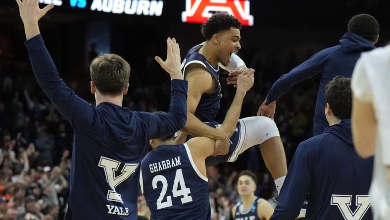 Mar 22, 2024; Spokane, WA, USA; Yale Bulldogs forward Matt Knowling (22) celebrates with guard Yassine Gharram (24) after a game against the Auburn Tigers in the first round of the 2024 NCAA Tournament at Spokane Veterans Memorial Arena. Mandatory Credit: Kirby Lee-USA TODAY Sports