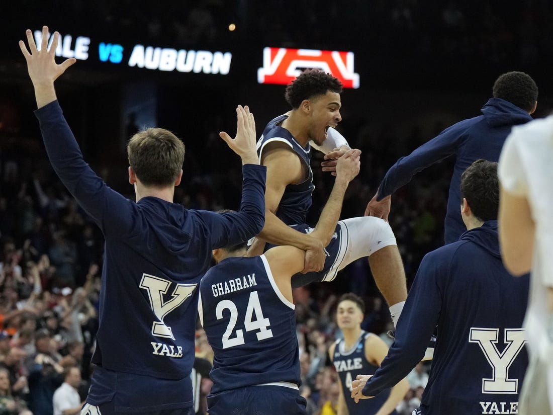 Mar 22, 2024; Spokane, WA, USA; Yale Bulldogs forward Matt Knowling (22) celebrates with guard Yassine Gharram (24) after a game against the Auburn Tigers in the first round of the 2024 NCAA Tournament at Spokane Veterans Memorial Arena. Mandatory Credit: Kirby Lee-USA TODAY Sports