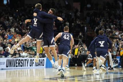 Mar 22, 2024; Spokane, WA, USA; Yale Bulldogs guard Trevor Mullin (0) celebrates with guard Emir Buyukhanli (11) after a game against the Auburn Tigers in the first round of the 2024 NCAA Tournament at Spokane Veterans Memorial Arena. Mandatory Credit: Kirby Lee-USA TODAY Sports