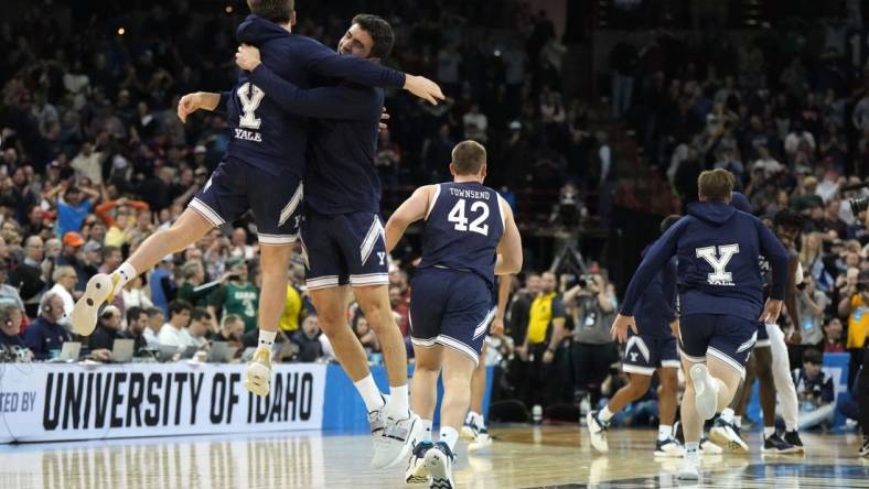 Mar 22, 2024; Spokane, WA, USA; Yale Bulldogs guard Trevor Mullin (0) celebrates with guard Emir Buyukhanli (11) after a game against the Auburn Tigers in the first round of the 2024 NCAA Tournament at Spokane Veterans Memorial Arena. Mandatory Credit: Kirby Lee-USA TODAY Sports