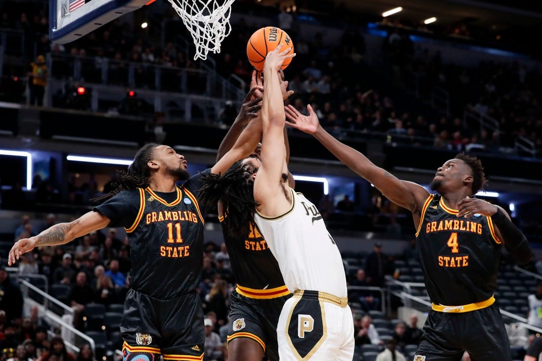 Purdue Boilermakers forward Trey Kaufman-Renn (4) goes up to fight for a rebound with Grambling State Tigers guard Jourdan Smith (11), Grambling State Tigers forward Jonathan Aku (12) and Grambling State Tigers forward Antwan Burnett (4) on Friday, March 22, 2024, during the first round of the NCAA Men’s Basketball Tournament at Gainbridge Fieldhouse in Indianapolis.