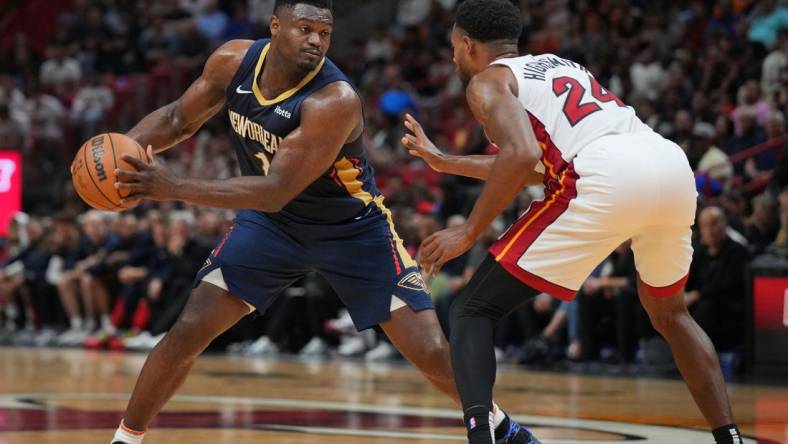 Mar 22, 2024; Miami, Florida, USA;  New Orleans Pelicans forward Zion Williamson (1) brings the ball up the court as Miami Heat forward Haywood Highsmith (24) during the first half at Kaseya Center. Mandatory Credit: Jim Rassol-USA TODAY Sports