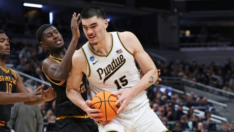 Mar 22, 2024; Indianapolis, IN, USA; Purdue Boilermakers center Zach Edey (15) makes a basket as Grambling State Tigers forward Malik Lamin (32) defends during the second half in the first round of the 2024 NCAA Tournament at Gainbridge FieldHouse. Mandatory Credit: Trevor Ruszkowski-USA TODAY Sports