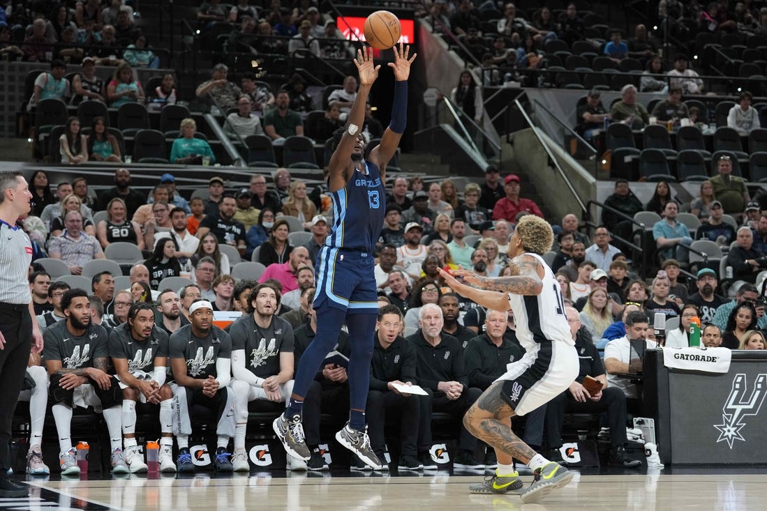 Mar 22, 2024; San Antonio, Texas, USA; Memphis Grizzlies forward Jaren Jackson Jr. (13) shoots over San Antonio Spurs forward Jeremy Sochan (10) in the first half at Frost Bank Center. Mandatory Credit: Daniel Dunn-USA TODAY Sports