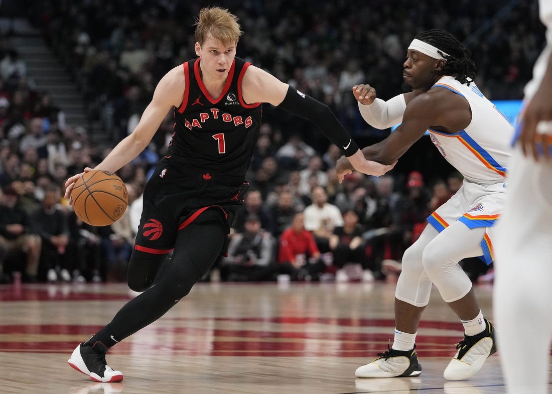 Mar 22, 2024; Toronto, Ontario, CAN; Toronto Raptors guard Gradey Dick (1) drives to the net against Oklahoma City Thunder forward Jalen Williams (8) during the second half at Scotiabank Arena. Mandatory Credit: John E. Sokolowski-USA TODAY Sports