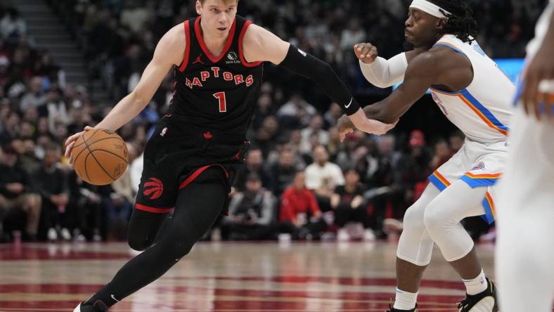 Mar 22, 2024; Toronto, Ontario, CAN; Toronto Raptors guard Gradey Dick (1) drives to the net against Oklahoma City Thunder forward Jalen Williams (8) during the second half at Scotiabank Arena. Mandatory Credit: John E. Sokolowski-USA TODAY Sports