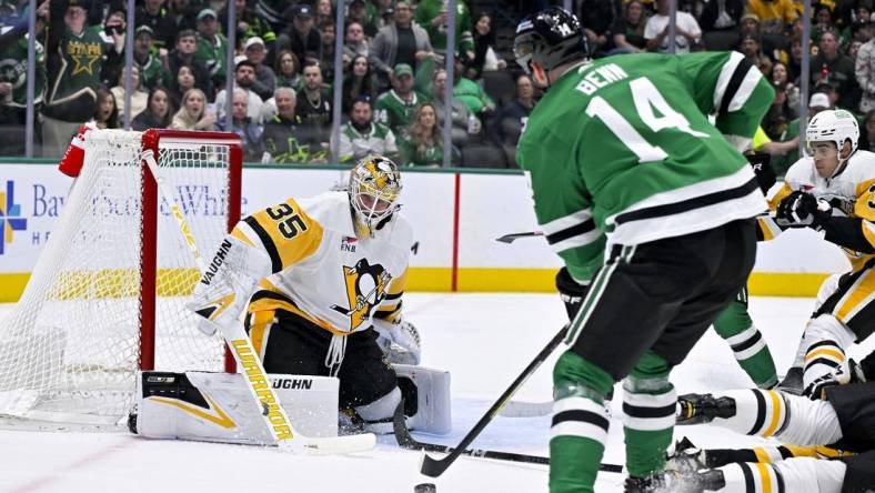 Mar 22, 2024; Dallas, Texas, USA; Dallas Stars left wing Jamie Benn (14) scores a goal against Pittsburgh Penguins goaltender Tristan Jarry (35) during the second period at the American Airlines Center. Mandatory Credit: Jerome Miron-USA TODAY Sports