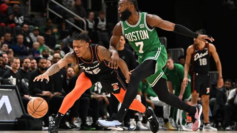 Mar 22, 2024; Detroit, Michigan, USA; Detroit Pistons guard Marcus Sasser (25) loses control of his dribble while being defended by Boston Celtics guard Jaylen Brown (7) in the third quarter at Little Caesars Arena. Mandatory Credit: Lon Horwedel-USA TODAY Sports