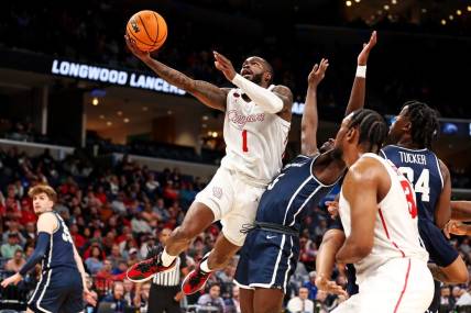 Mar 22, 2024; Memphis, TN, USA;  Houston Cougars guard Jamal Shead (1) shoots the ball against Longwood Lancers guard Johnathan Massie (5) during the first half in the first round of the 2024 NCAA Tournament at FedExForum. Mandatory Credit: Petre Thomas-USA TODAY Sports