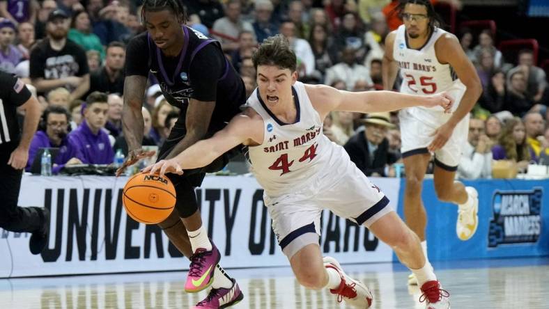 Mar 22, 2024; Spokane, WA, USA; Grand Canyon Antelopes guard Tyon Grant-Foster (7) and St. Mary's Gaels guard Alex Ducas (44) chase a loose ball during the first half in the first round of the 2024 NCAA Tournament at Spokane Veterans Memorial Arena. Mandatory Credit: Kirby Lee-USA TODAY Sports