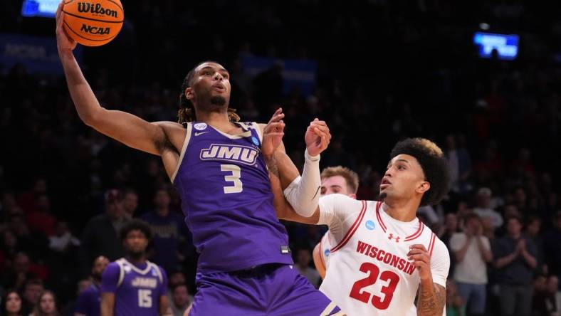 Mar 22, 2024; Brooklyn, NY, USA; James Madison Dukes forward T.J. Bickerstaff (3) shoots the ball over Wisconsin Badgers guard Chucky Hepburn (23) in the first round of the 2024 NCAA Tournament at the Barclays Center.  Mandatory Credit: Robert Deutsch-USA TODAY Sports