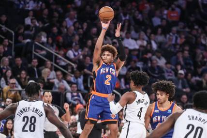 Mar 23, 2024; New York, New York, USA;  New York Knicks guard Miles McBride (2) takes a three point shot in the first quarter against the Brooklyn Nets at Madison Square Garden. Mandatory Credit: Wendell Cruz-USA TODAY Sports