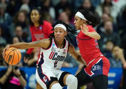 Mar 23, 2024; Storrs, Connecticut, USA; UConn Huskies guard KK Arnold (2) moves the ball against Jackson State Lady Tigers guard Zakiya Mahoney (22) in the second half at Harry A. Gampel Pavilion. Mandatory Credit: David Butler II-USA TODAY Sports