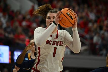 Mar 23, 2024; Raleigh, North Carolina, USA; NC State Wolfpack center River Baldwin (1) grabs a rebound in the first round of the 2024 NCAA Women's Tournament at James T. Valvano Arena at William Neal Reynolds. Mandatory Credit: William Howard-USA TODAY Sports