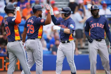Mar 23, 2024; Port St. Lucie, Florida, USA;  Houston Astros third baseman Alex Bregman, center, is congratulated by first baseman Jose Abreu (79), right fielder Kyle Tucker (30) and designated hitter Yordan Alvarez, right, after hitting a three-run home run in the first inning against the New York Mets at Clover Park. Mandatory Credit: Jim Rassol-USA TODAY Sports
