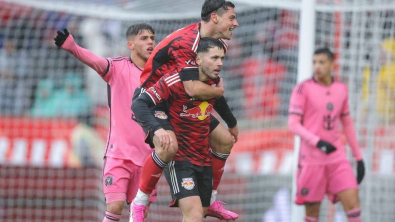 Mar 23, 2024; Harrison, New Jersey, USA; New York Red Bulls midfielder Lewis Morgan (9) celebrates his goal with forward Dante Vanzeir (13) in the second half against Inter Miami CF at Red Bull Arena. Mandatory Credit: Brad Penner-USA TODAY Sports