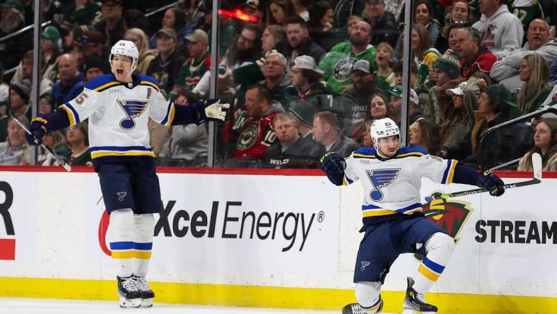 Mar 23, 2024; Saint Paul, Minnesota, USA; St. Louis Blues center Jordan Kyrou (25) celebrates his hat-trick against the Minnesota Wild during the third period at Xcel Energy Center. Mandatory Credit: Matt Krohn-USA TODAY Sports