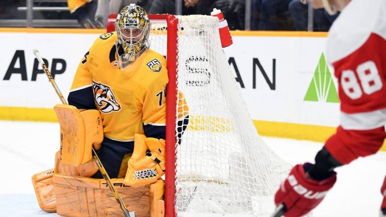 Mar 23, 2024; Nashville, Tennessee, USA; Nashville Predators goaltender Juuse Saros (74) watches as Detroit Red Wings right wing Patrick Kane (88) handles the puck in the corner during the second period at Bridgestone Arena. Mandatory Credit: Christopher Hanewinckel-USA TODAY Sports