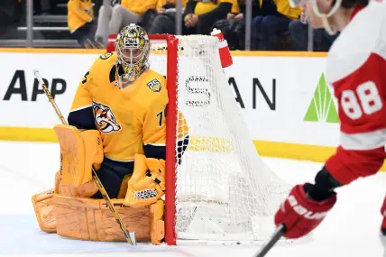 Mar 23, 2024; Nashville, Tennessee, USA; Nashville Predators goaltender Juuse Saros (74) watches as Detroit Red Wings right wing Patrick Kane (88) handles the puck in the corner during the second period at Bridgestone Arena. Mandatory Credit: Christopher Hanewinckel-USA TODAY Sports