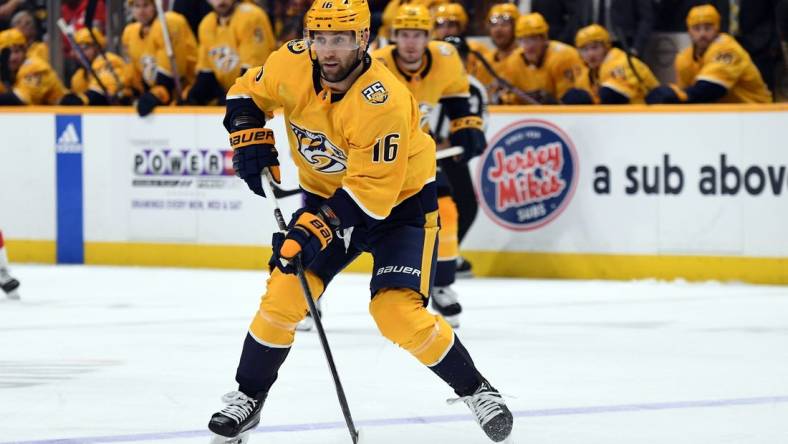 Mar 23, 2024; Nashville, Tennessee, USA; Nashville Predators left wing Jason Zucker (16) skates the puck into the offensive zone during the third period against the Detroit Red Wings at Bridgestone Arena. Mandatory Credit: Christopher Hanewinckel-USA TODAY Sports