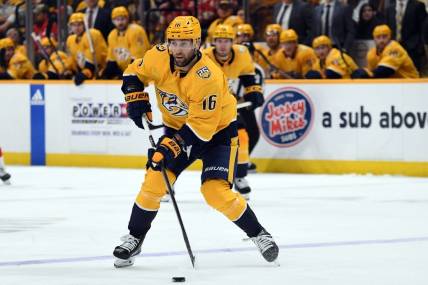Mar 23, 2024; Nashville, Tennessee, USA; Nashville Predators left wing Jason Zucker (16) skates the puck into the offensive zone during the third period against the Detroit Red Wings at Bridgestone Arena. Mandatory Credit: Christopher Hanewinckel-USA TODAY Sports