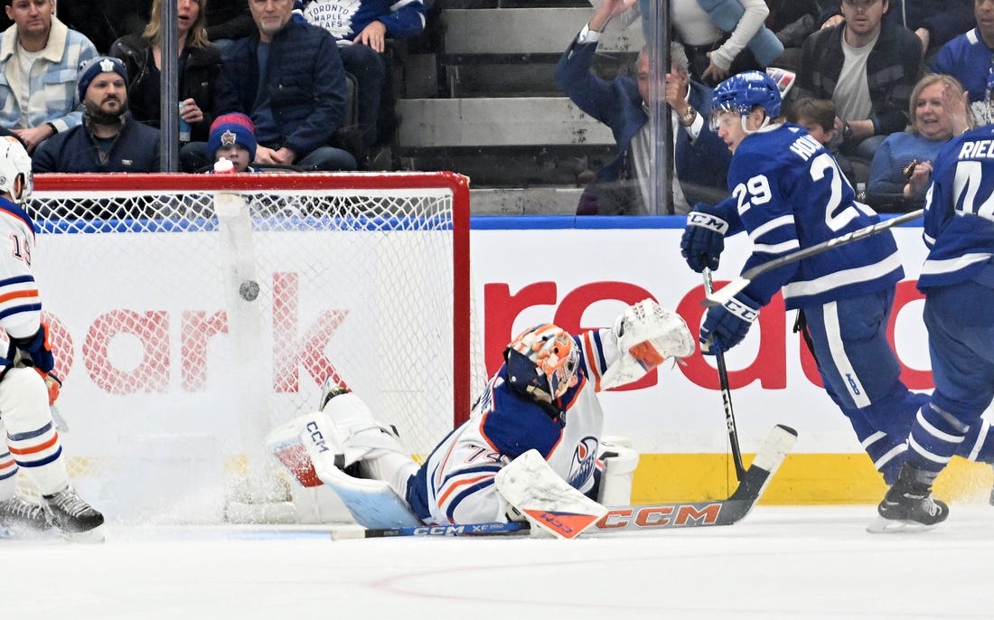 Mar 23, 2024; Toronto, Ontario, CAN; Toronto Maple Leafs forward Pontus Holmberg (29) scores a goal past Edmonton Oilers goalie Stuart Skinner (74) in the second period at Scotiabank Arena. Mandatory Credit: Dan Hamilton-USA TODAY Sports