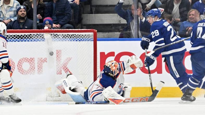 Mar 23, 2024; Toronto, Ontario, CAN; Toronto Maple Leafs forward Pontus Holmberg (29) scores a goal past Edmonton Oilers goalie Stuart Skinner (74) in the second period at Scotiabank Arena. Mandatory Credit: Dan Hamilton-USA TODAY Sports