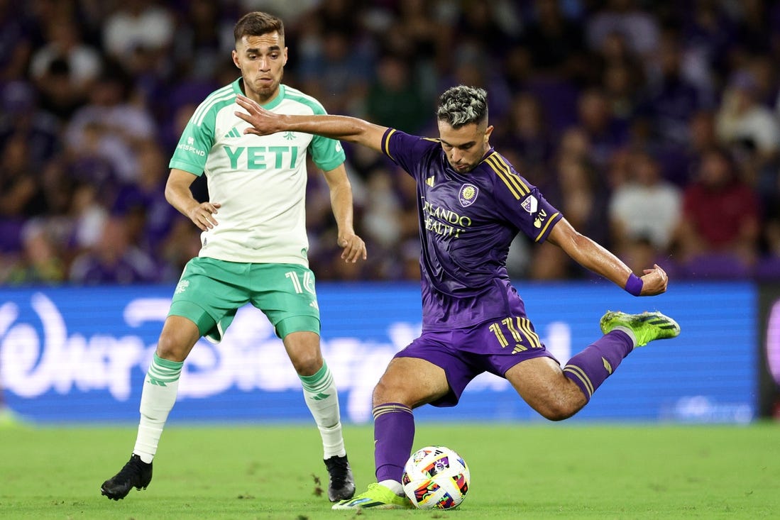 Mar 23, 2024; Orlando, Florida, USA; Orlando City midfielder Martin Ojeda (11) controls the ball against Austin FC defender Hector Jimenez (16) in the second half at Inter&Co Stadium. Mandatory Credit: Nathan Ray Seebeck-USA TODAY Sports