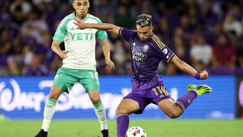 Mar 23, 2024; Orlando, Florida, USA; Orlando City midfielder Martin Ojeda (11) controls the ball against Austin FC defender Hector Jimenez (16) in the second half at Inter&Co Stadium. Mandatory Credit: Nathan Ray Seebeck-USA TODAY Sports