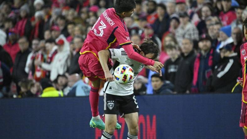 Mar 23, 2024; St. Louis, Missouri, USA; St. Louis CITY SC defender Anthony Markanich (13) challenges D.C. United midfielder Jared Stroud (8) for the ball during the second half at CITYPARK. Mandatory Credit: Scott Rovak-USA TODAY Sports