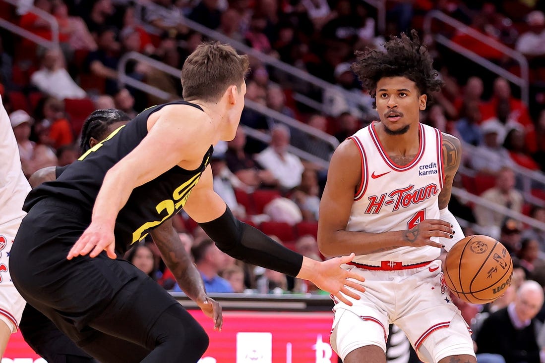 Mar 23, 2024; Houston, Texas, USA; Houston Rockets guard Jalen Green (4) handles the ball against Utah Jazz center Walker Kessler (24) during the third quarter at Toyota Center. Mandatory Credit: Erik Williams-USA TODAY Sports