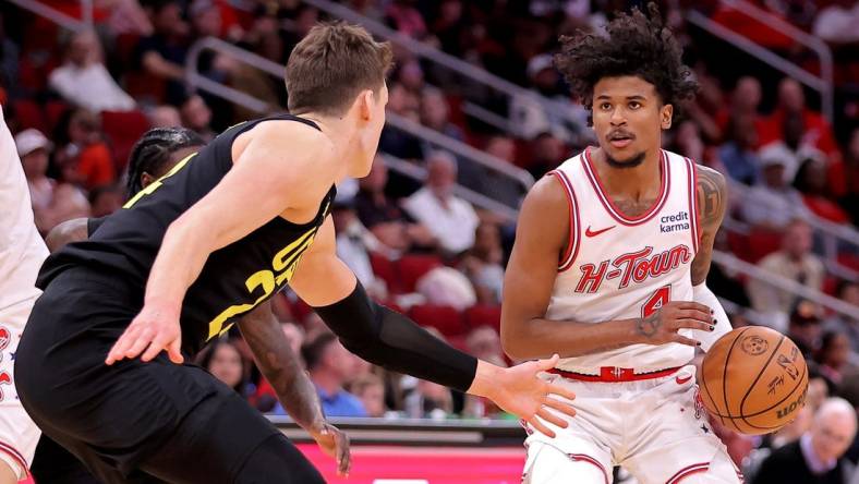 Mar 23, 2024; Houston, Texas, USA; Houston Rockets guard Jalen Green (4) handles the ball against Utah Jazz center Walker Kessler (24) during the third quarter at Toyota Center. Mandatory Credit: Erik Williams-USA TODAY Sports