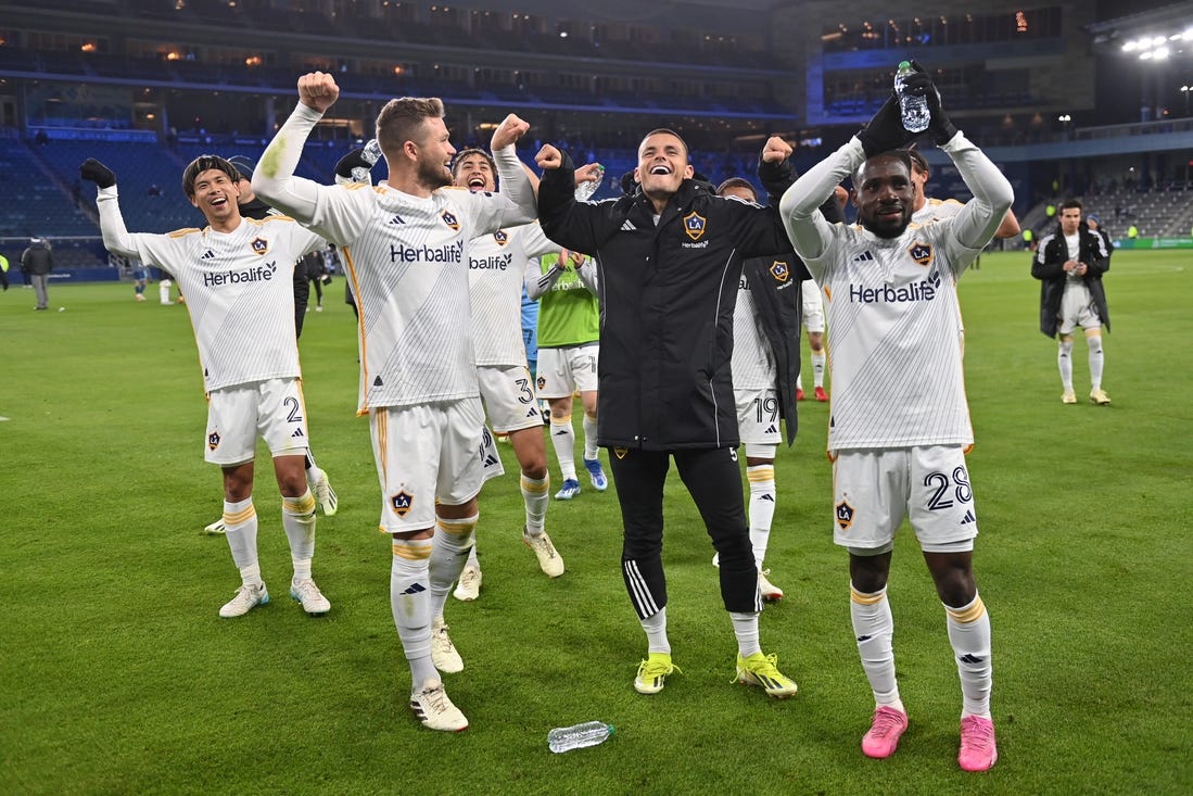 Mar 23, 2024; Kansas City, Kansas, USA; Members of the LA Galaxy celebrate after defeating Sporting Kansas City at Children's Mercy Park. Mandatory Credit: Peter Aiken-USA TODAY Sports