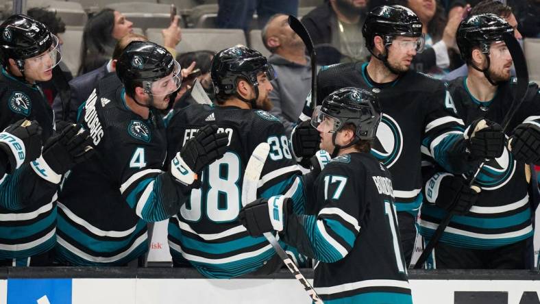 Mar 23, 2024; San Jose, California, USA; San Jose Sharks center Thomas Bordeleau (17) shakes hands with his teammates on the bench after scoring a goal against the Chicago Blackhawks during the first period at SAP Center at San Jose. Mandatory Credit: Robert Edwards-USA TODAY Sports