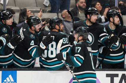 Mar 23, 2024; San Jose, California, USA; San Jose Sharks center Thomas Bordeleau (17) shakes hands with his teammates on the bench after scoring a goal against the Chicago Blackhawks during the first period at SAP Center at San Jose. Mandatory Credit: Robert Edwards-USA TODAY Sports