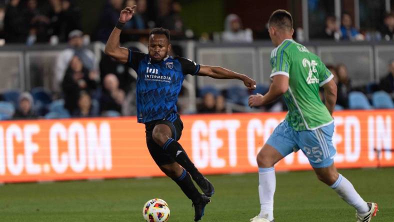 Mar 24, 2024; San Jose, California, USA; San Jose Earthquakes forward Jeremy Ebobisse (11) dribbles against Seattle Sounders FC defender Jackson Ragen (25) during the second half at PayPal Park. Mandatory Credit: Stan Szeto-USA TODAY Sports