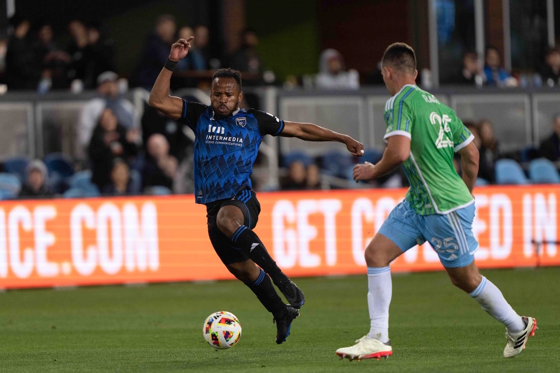 Mar 24, 2024; San Jose, California, USA; San Jose Earthquakes forward Jeremy Ebobisse (11) dribbles against Seattle Sounders FC defender Jackson Ragen (25) during the second half at PayPal Park. Mandatory Credit: Stan Szeto-USA TODAY Sports