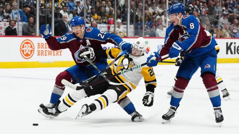 Mar 24, 2024; Denver, Colorado, USA; Colorado Avalanche center Nathan MacKinnon (29) and Colorado Avalanche defenseman Cale Makar (8) defend on Pittsburgh Penguins center Lars Eller (20) in the first period at Ball Arena. Mandatory Credit: Ron Chenoy-USA TODAY Sports