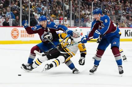 Mar 24, 2024; Denver, Colorado, USA; Colorado Avalanche center Nathan MacKinnon (29) and Colorado Avalanche defenseman Cale Makar (8) defend on Pittsburgh Penguins center Lars Eller (20) in the first period at Ball Arena. Mandatory Credit: Ron Chenoy-USA TODAY Sports