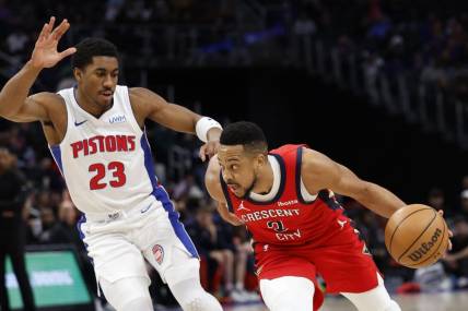 Mar 24, 2024; Detroit, Michigan, USA;  New Orleans Pelicans guard CJ McCollum (3) dribbles on Detroit Pistons guard Jaden Ivey (23) in the first half at Little Caesars Arena. Mandatory Credit: Rick Osentoski-USA TODAY Sports