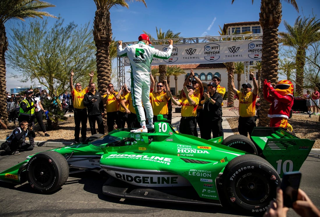 Alex Palou of Chip Ganassi Racing celebrates winning the feature race of the $1 Million Challenge with his team at The Thermal Club in Thermal, Calif., Sunday, March 24, 2024.