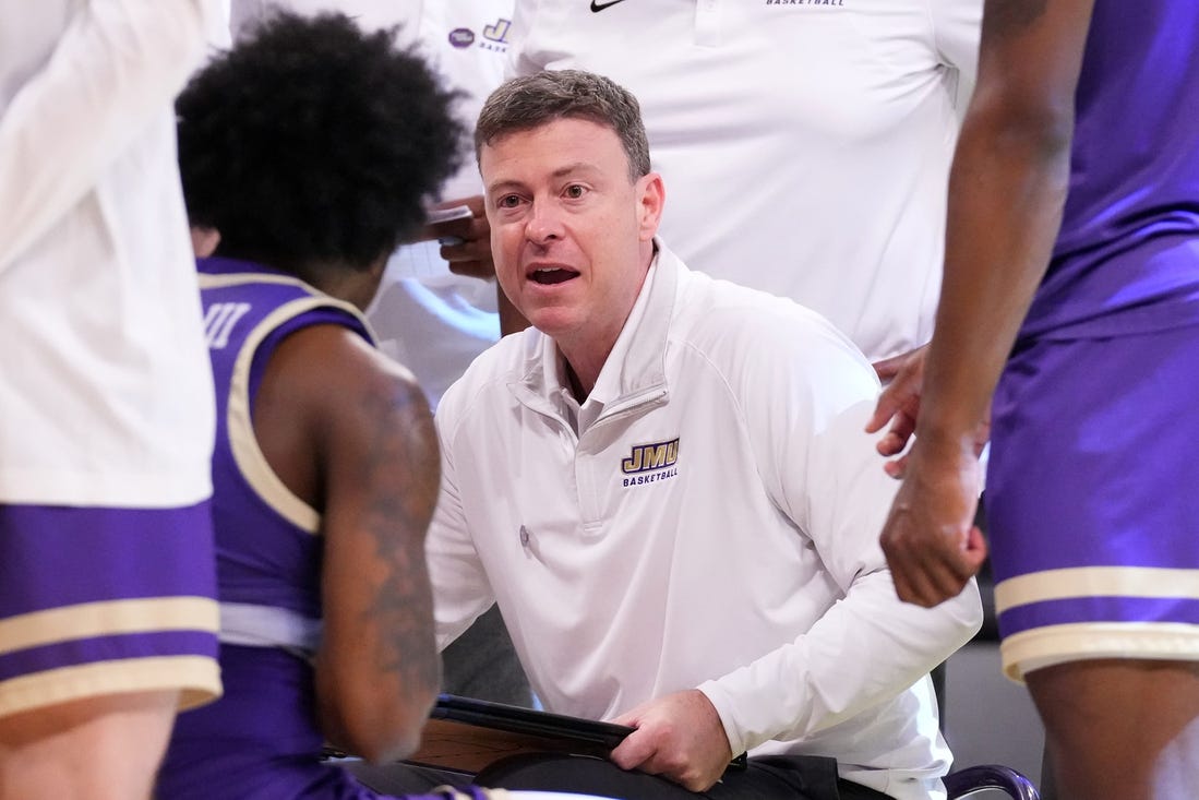 Mar 24, 2024; Brooklyn, NY, USA; James Madison Dukes head coach Mark Byington talks to the team during a time out against the Duke Blue Devils in the second round of the 2024 NCAA Tournament  at Barclays Center. Mandatory Credit: Robert Deutsch-USA TODAY Sports