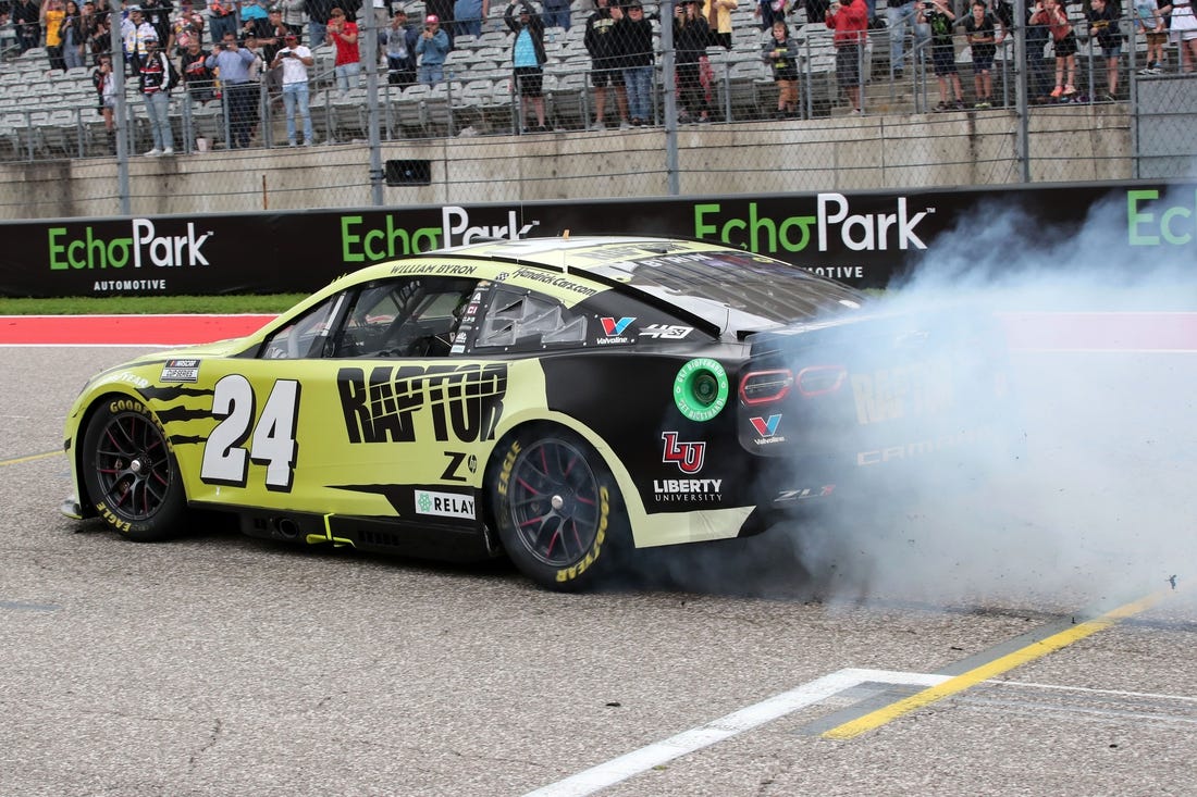 Mar 24, 2024; Austin, Texas, USA;  NASCAR Cup Series driver William Byron (24) performs a burn out after winning the EchoPark Automotive Grand Prix at Circuit of the Americas. Mandatory Credit: Michael C. Johnson-USA TODAY Sports